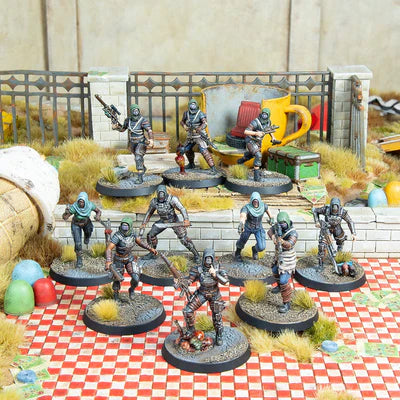 Set of miniature figures on a checkered surface with a detailed background